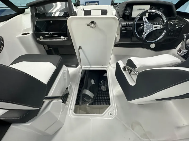 Slide: The Image of Storage compartment in a 2025 Monterey M45 boat with packaged items inside. - 42