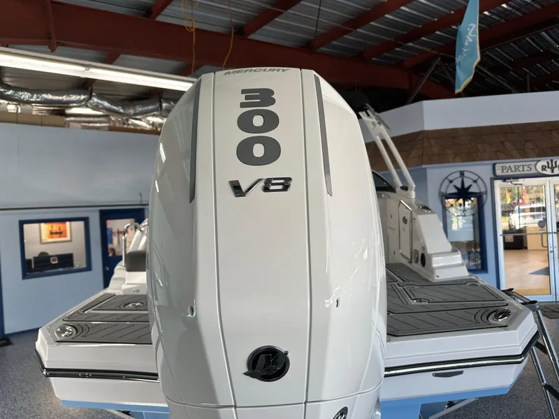 Slide: The Image of 2025 Monterey M45 boat with Mercury engine in a metal-roofed storage facility. - 48