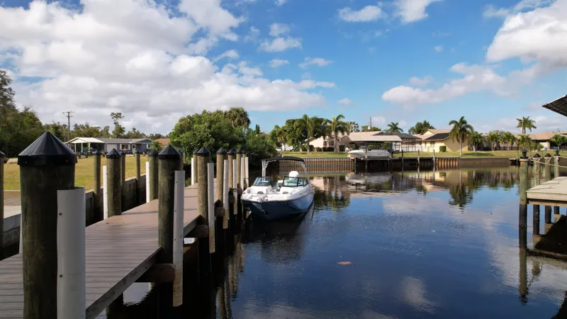 Slide: The Image of 2025 Monterey M45 boat displayed indoors on stands, showcasing sleek design and modern features. - 6