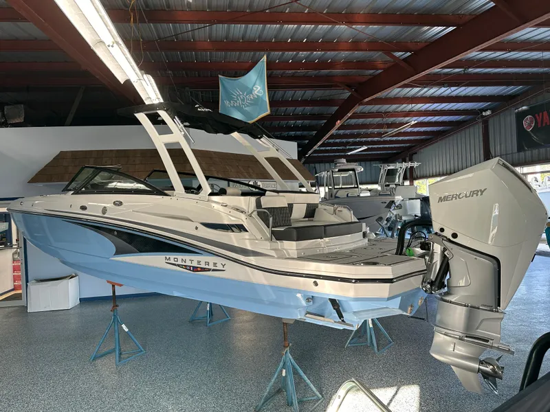 Slide: The Image of 2025 Monterey M45 boat displayed indoors on stands, featuring sleek design and modern architecture. - 9