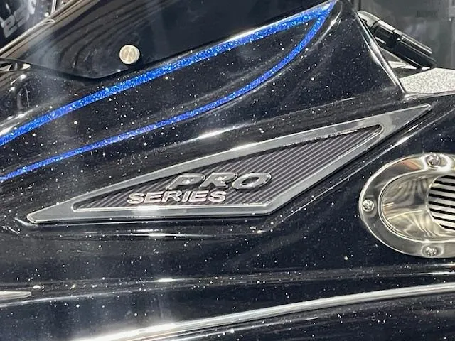 Slide: The Image of 2025 Caymas CX 20 Pro Series boat detail with sleek black and blue design. - 12