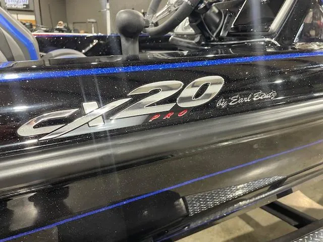 Slide: The Image of 2025 Caymas CX 20 Pro boat with sleek black finish and blue accents. - 4