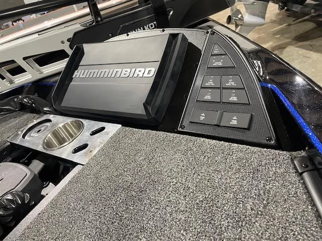 Slide: The Image of 2025 Caymas CX 20 boat dashboard with Humminbird electronics and control panel. - 7