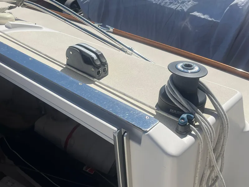 Slide: The Image of Deck of 2005 J Boats J/100 sailboat with winch and cleat. - 26