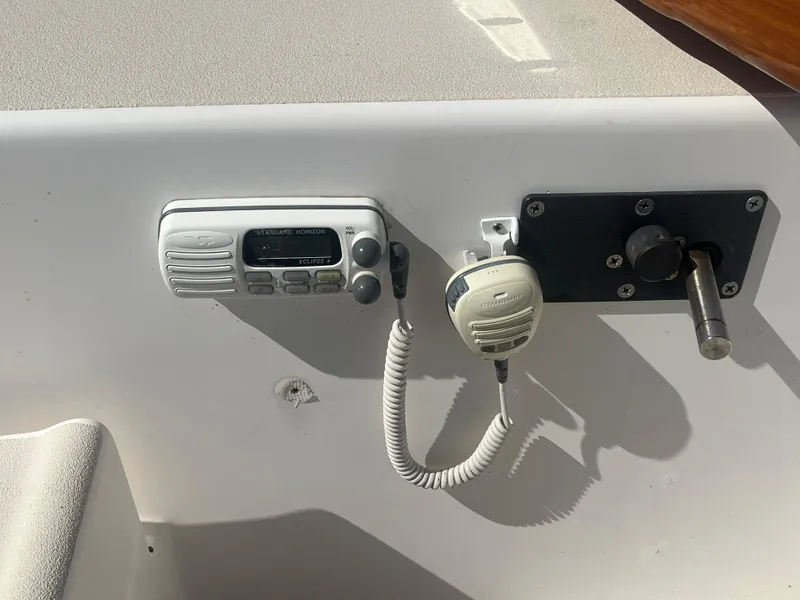 Slide: The Image of 2005 J Boats J/100 cockpit with radio and control panel. - 29