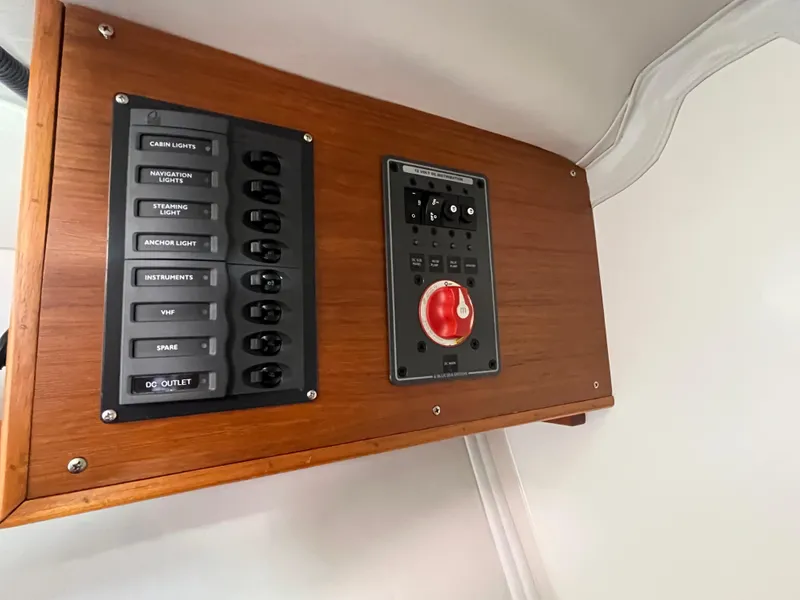 Slide: The Image of Electrical panel on a 2005 J Boats J/100 sailboat, featuring switches and controls. - 33