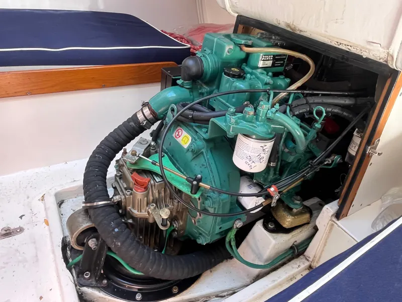 Slide: The Image of Engine compartment of a 2005 J Boats J/100 sailboat, showcasing detailed mechanical components. - 35