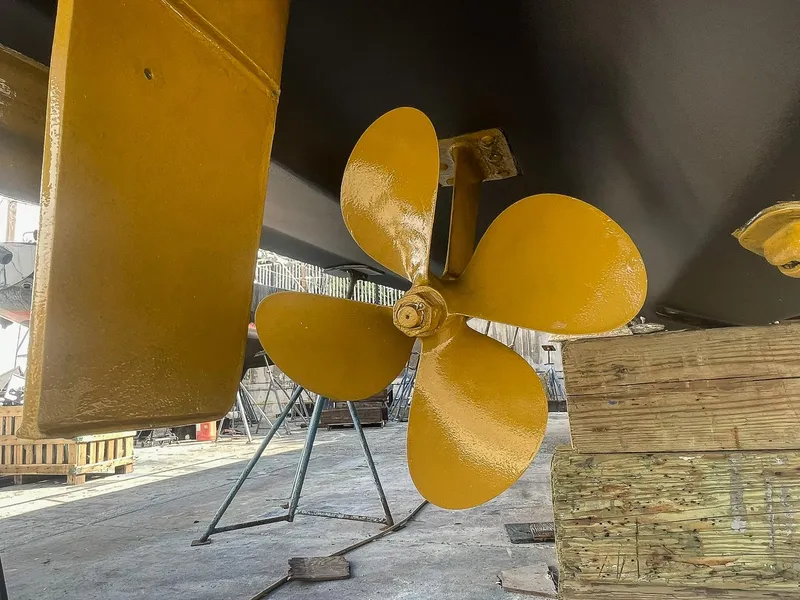 Slide: The Image of Yellow propeller of a 1999 Sea Ray 400 Sundancer in a shipyard. - 31
