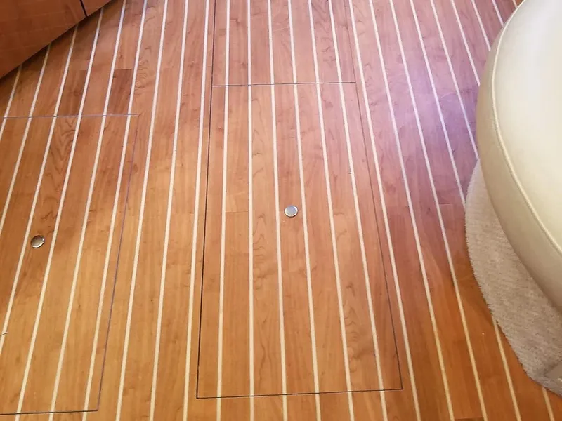 Slide: The Image of Teak flooring on a 1999 Sea Ray 400 Sundancer yacht interior. - 36