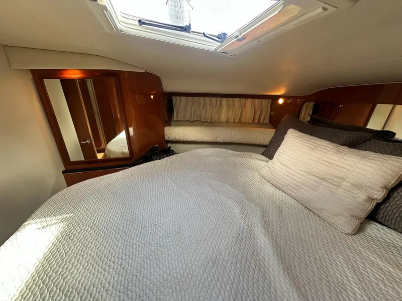 Slide: The Image of Interior cabin of 1999 Sea Ray 400 Sundancer yacht with bed and skylight. - 41