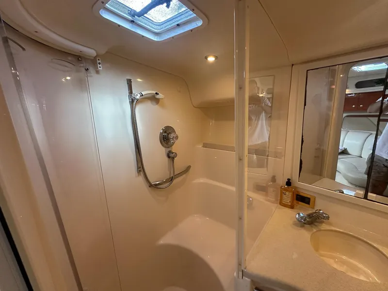 Slide: The Image of Bathroom interior of 1999 Sea Ray 400 Sundancer yacht, featuring shower and sink. - 45