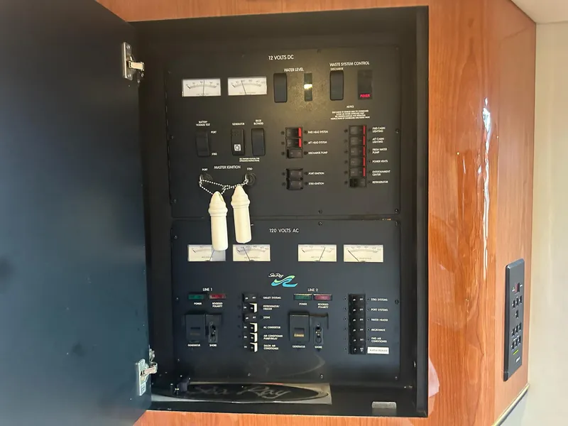 Slide: The Image of Electrical control panel of a 1999 Sea Ray 400 Sundancer boat. - 46