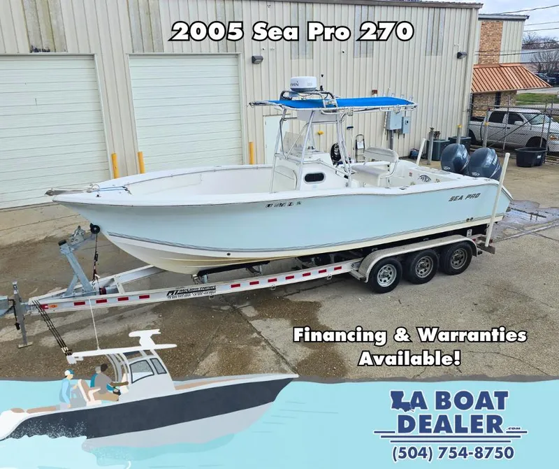 Slide: The Image of 2005 Sea Pro 270 Center Console boat on trailer at dealership, financing available. - 1