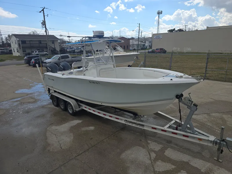Slide: The Image of 2005 Sea Pro 270 Center Console boat on trailer in parking lot. - 12