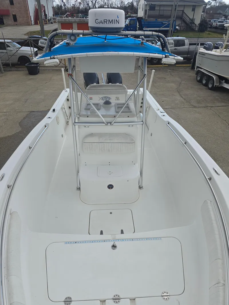 Slide: The Image of 2005 Sea Pro 270 Center Console boat with Garmin equipment, docked in a marina. - 3