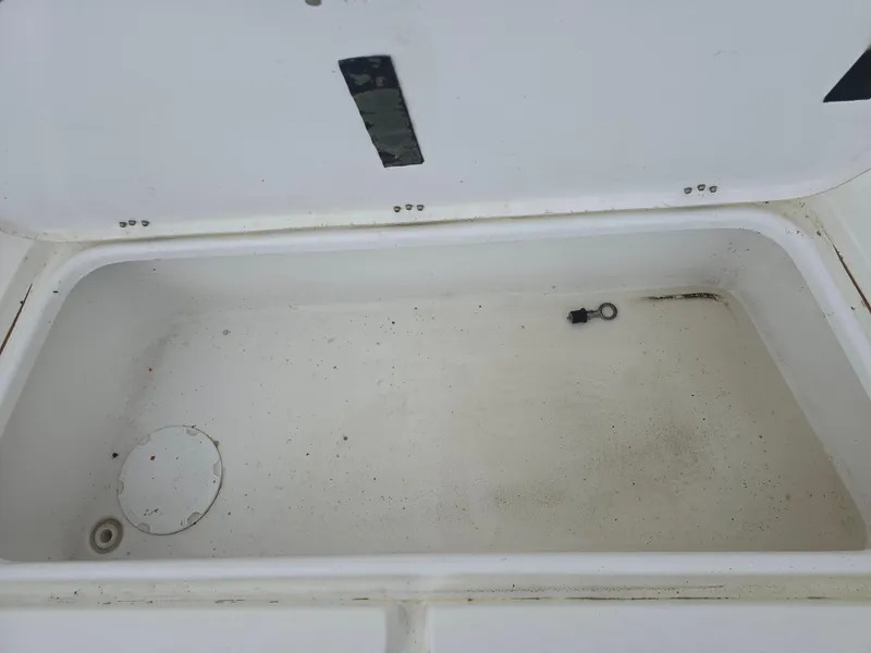 Slide: The Image of Open storage compartment on 2005 Sea Pro 270 Center Console boat. - 4