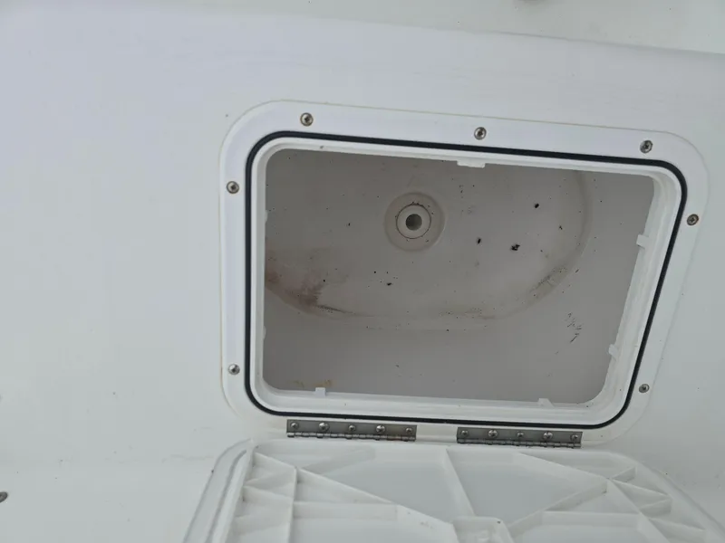 Slide: The Image of Open storage compartment on 2005 Sea Pro 270 Center Console boat. - 6