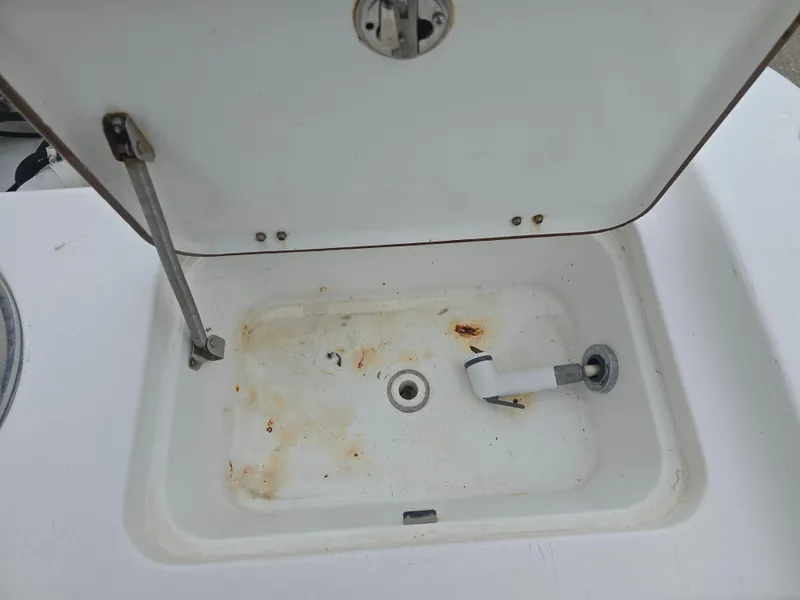 Slide: The Image of Open storage compartment on 2005 Sea Pro 270 Center Console boat. - 8