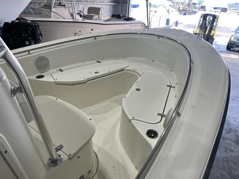 Slide: The Image of 2005 Pursuit 2570 Center Console boat interior with seating and storage compartments. - 15