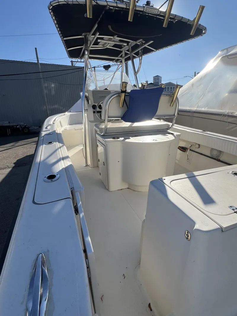 Slide: The Image of 2005 Pursuit 2570 Center Console boat with T-top and seating. - 19