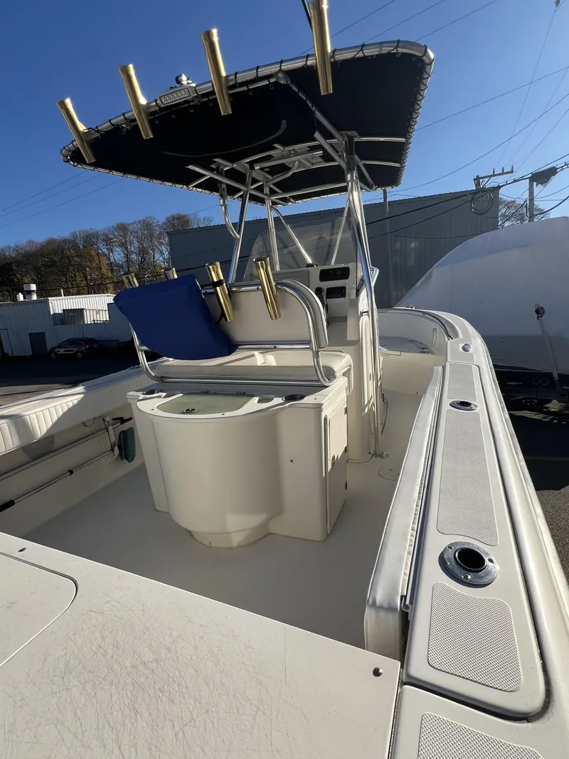 Slide: The Image of 2005 Pursuit 2570 Center Console boat with T-top and fishing rod holders. - 20