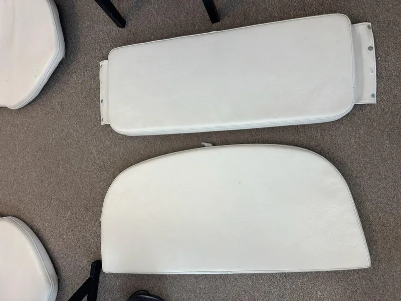 Slide: The Image of White boat cushions for 2005 Pursuit 2570 Center Console on carpeted floor. - 22