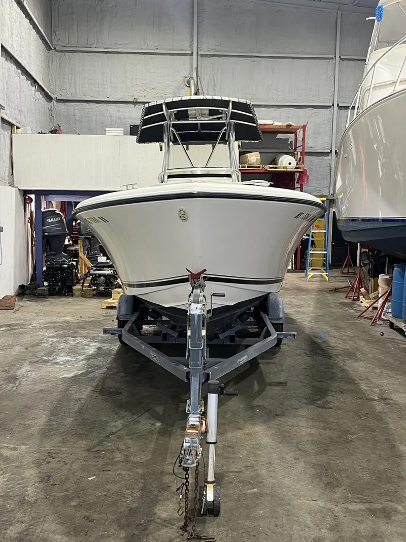 Slide: The Image of 2005 Pursuit 2570 Center Console boat on trailer in storage facility. - 28