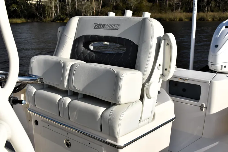 Slide: The Image of 2024 Pathfinder 2700 Open boat seat, featuring luxurious white and black upholstery. - 11