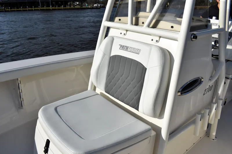 Slide: The Image of 2024 Pathfinder 2700 Open boat seat with quilted design, near water. - 13