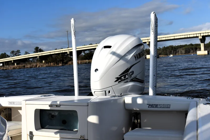 Slide: The Image of 2024 Pathfinder 2700 Open boat with Yamaha engine on a river. - 16