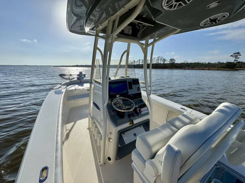 Slide: The Image of 2024 Pathfinder 2700 Open boat on water, featuring modern helm and seating. - 18