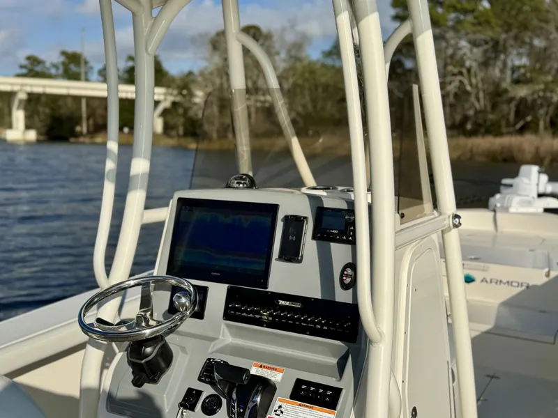 Slide: The Image of 2024 Pathfinder 2700 Open boat console with steering wheel and navigation system. - 20