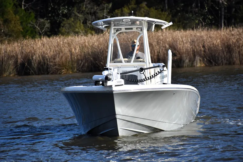 Slide: The Image of 2024 Pathfinder 2700 Open boat cruising on a calm river. - 4