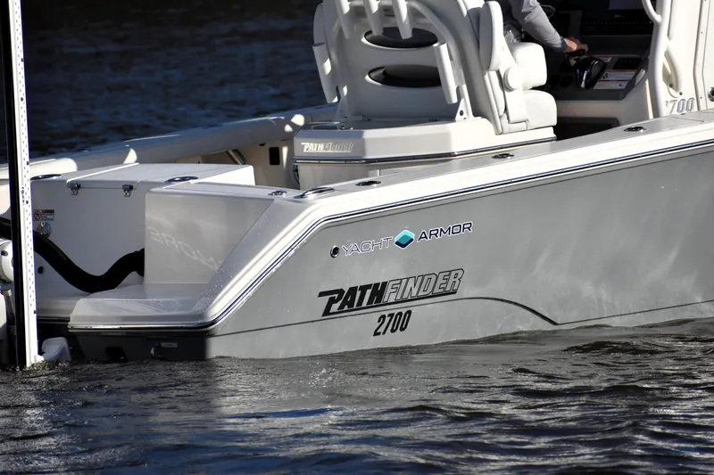 Slide: The Image of 2024 Pathfinder 2700 Open boat on water, showcasing sleek design and branding. - 8