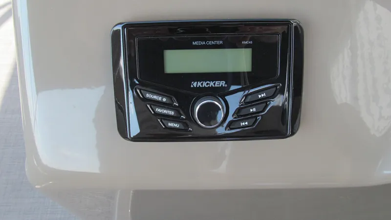 Slide: The Image of Kicker media center on 2023 Sun Tracker SportFish 22 DLX boat dashboard. - 13