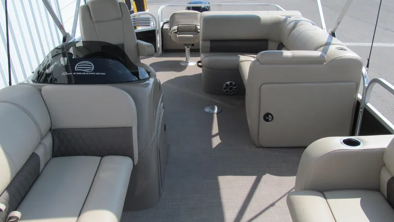 Slide: The Image of 2023 Sun Tracker SportFish 22 DLX pontoon boat interior with plush seating and modern design. - 4