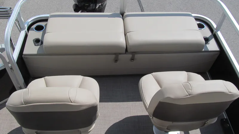 Slide: The Image of 2023 Sun Tracker SportFish 22 DLX boat interior with cushioned seating and cup holders. - 7