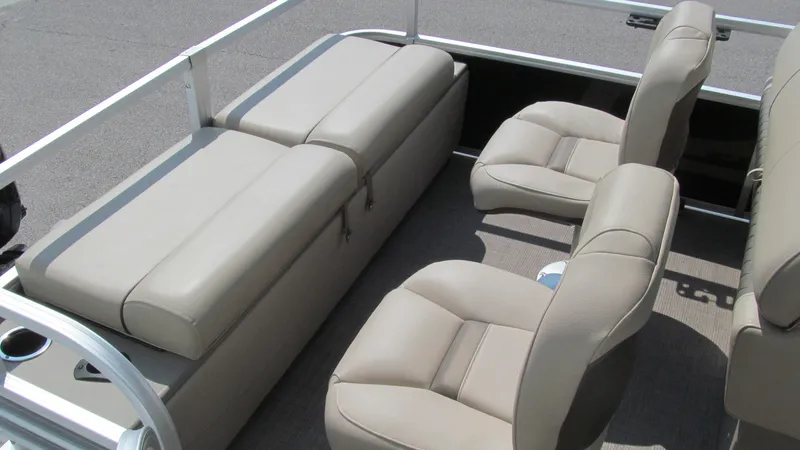 Slide: The Image of 2023 Sun Tracker SportFish 22 DLX interior with beige seating and spacious layout. - 8