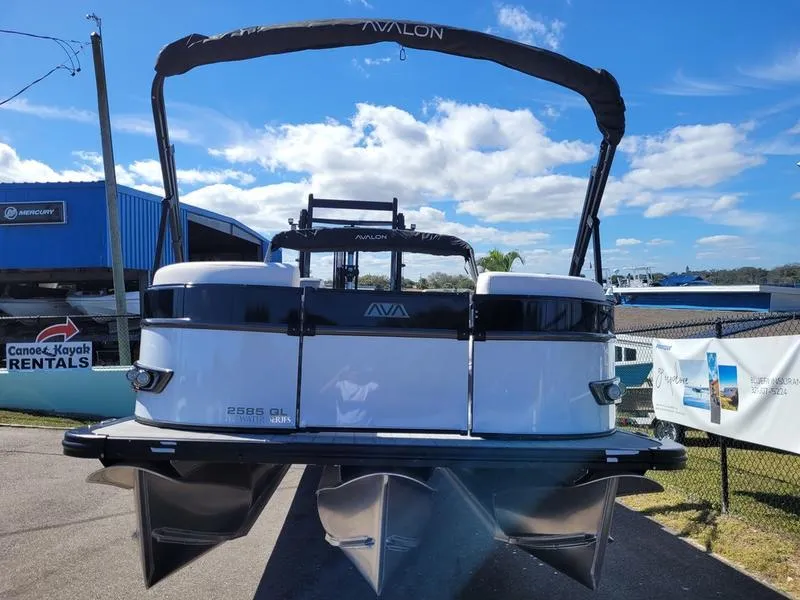 Slide: The Image of 2025 Avalon 2585 Catalina Quad Lounger pontoon boat at a rental facility. - 3