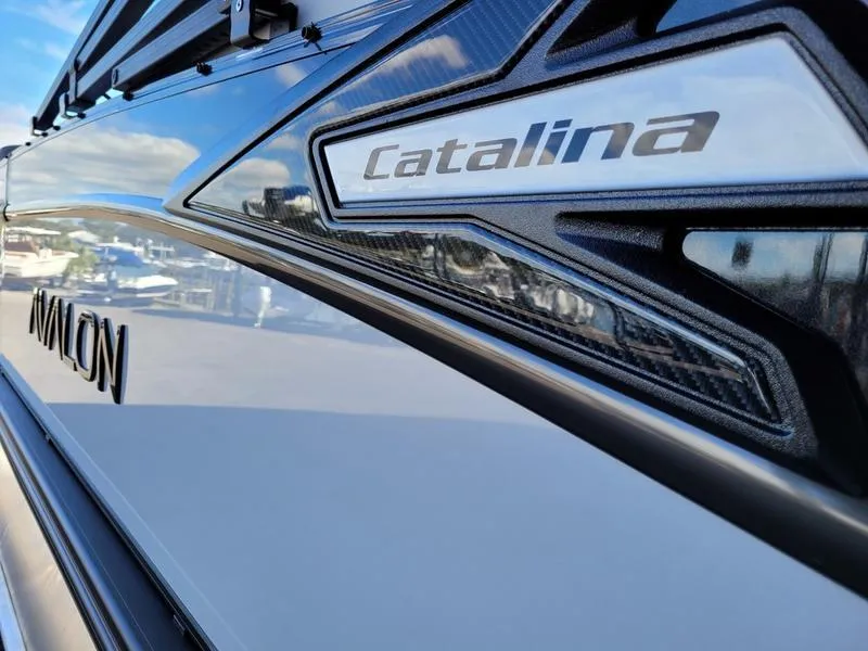 Slide: The Image of 2025 Avalon 2585 Catalina Quad Lounger, sleek design detail with reflective surface. - 4