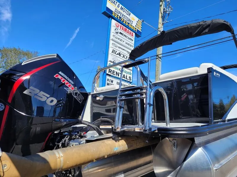 Slide: The Image of 2025 Avalon 2585 Catalina Quad Lounger with powerful 250 Pro XS engine, displayed outdoors. - 5