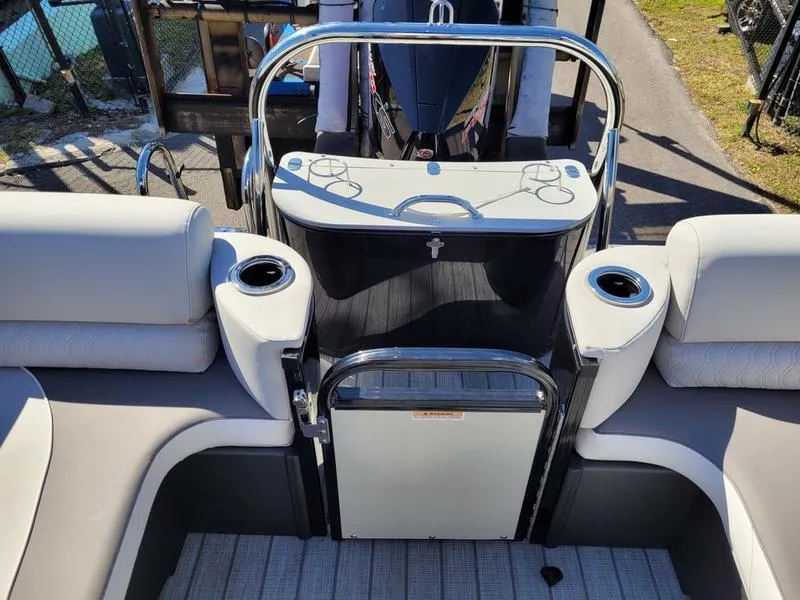 Slide: The Image of 2025 Avalon 2585 Catalina Quad Lounger interior with sleek seating and cup holders. - 6