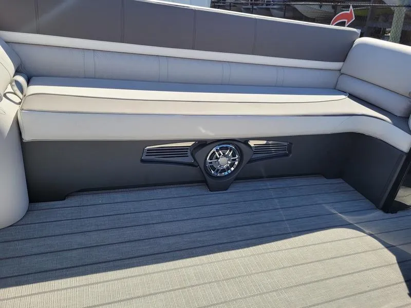 Slide: The Image of 2025 Avalon 2585 Catalina Quad Lounger interior with sleek seating and integrated speaker. - 7