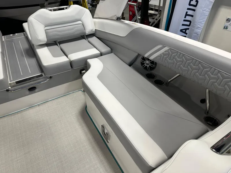 Slide: The Image of 2025 Regal LS6 boat interior with luxurious gray seating and modern design. - 12