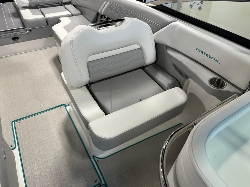 Slide: The Image of 2025 Regal LS6 boat interior with white seating and modern design. - 15