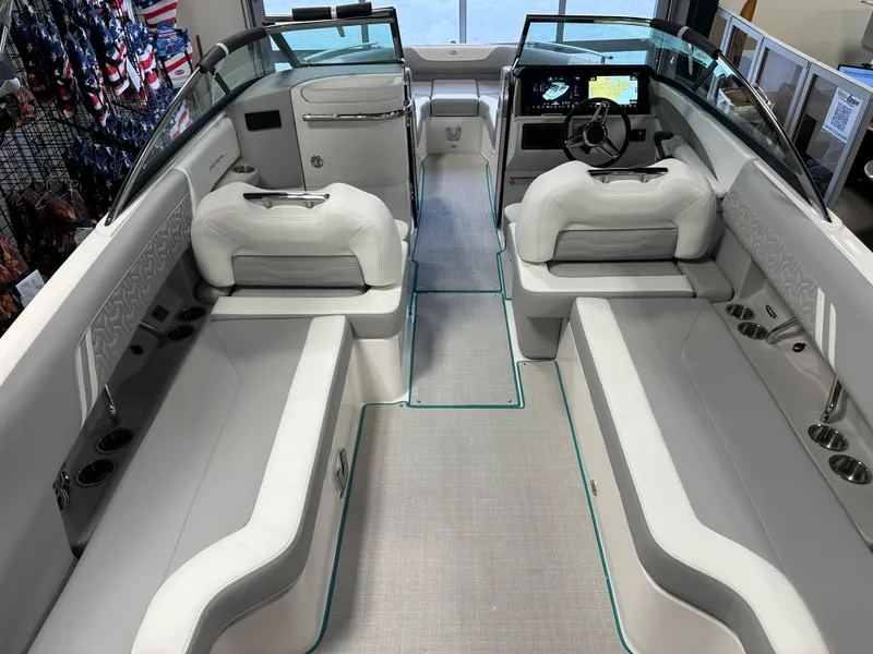 Slide: The Image of 2025 Regal LS6 boat interior with white seating and modern dashboard design. - 23
