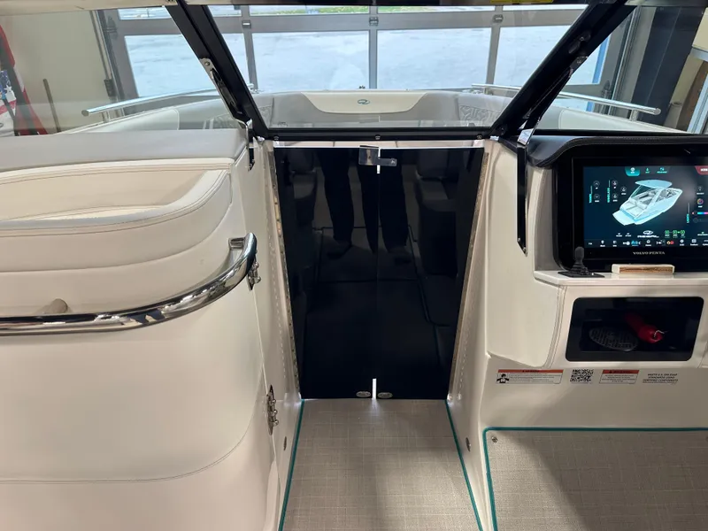 Slide: The Image of Interior view of 2025 Regal LS6 boat with modern dashboard and sleek design. - 6