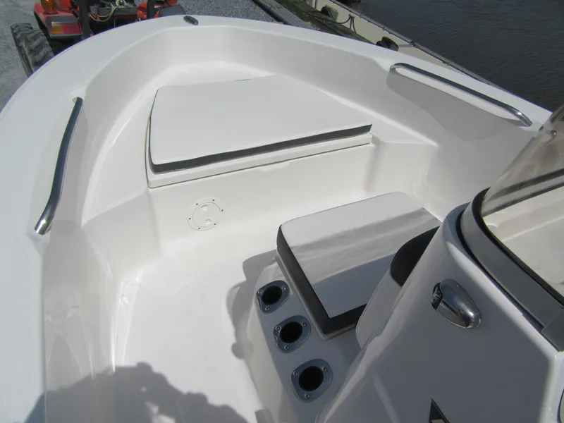 Slide: The Image of 2025 Robalo R160 Center Console boat interior with seating and cup holders. - 3