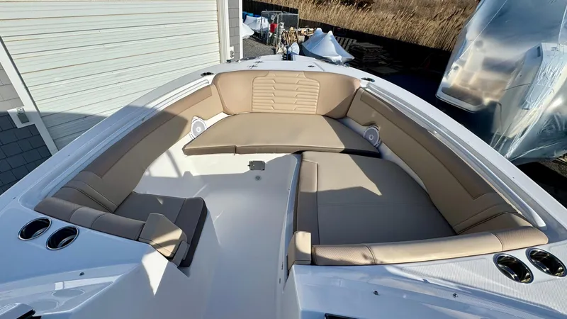 Slide: The Image of 2025 Edgewater 262CX boat with spacious seating and modern design. - 29