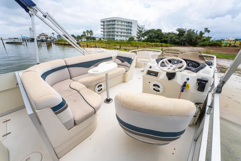 Slide: The Image of 2008 Bennington 201FS Southwind boat interior with plush seating and steering console. - 21